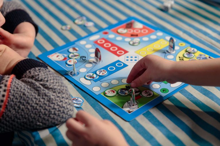 Two children playing a Ferrero Kinder Promotional Board Game