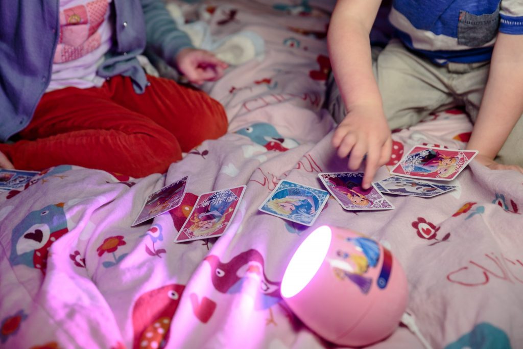 Children playing Happy Families Card Game